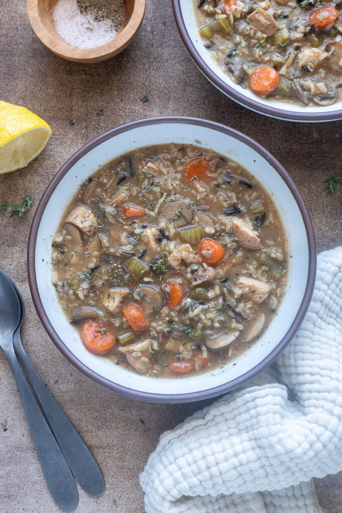Chicken wild rice soup with no cream in a bowl.
