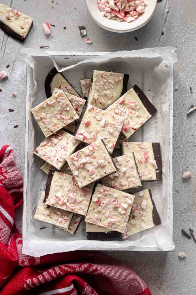 Easy peppermint bark in a white box with crushed candy cane.
