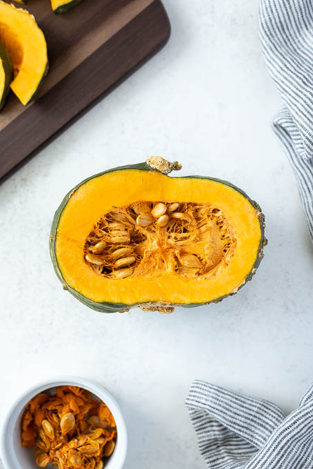 Halved kabocha squash with seeds.