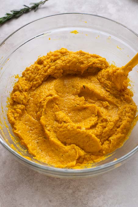 Creamy kabocha mash in a mixing bowl.