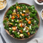 Winter roasted vegetable kale salad in a serving bowl.