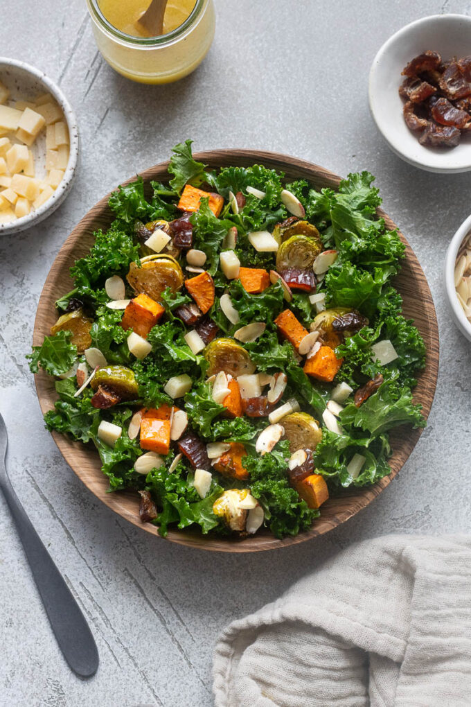 Winter roasted vegetable kale salad in a serving bowl.