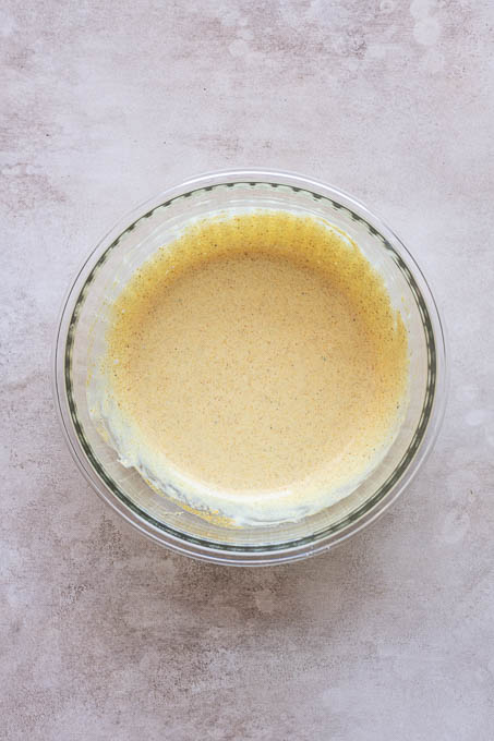Creamy curry dressing in a bowl.