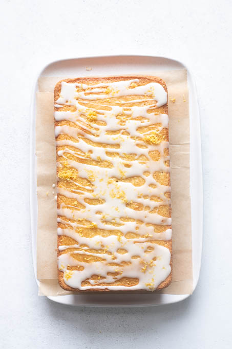 Lemon glaze drizzled over gluten-free lemon loaf.