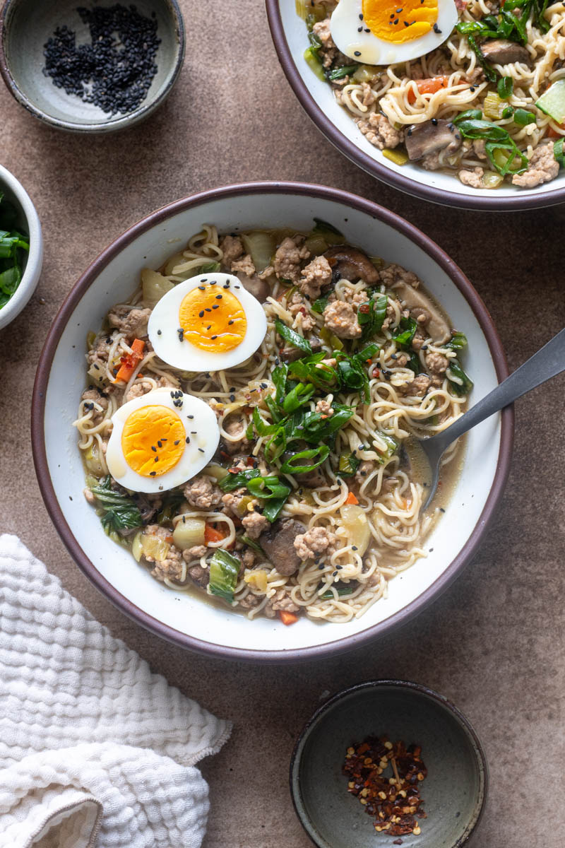 Ground pork ramen with bok choy, shiitake mushrooms, and topped with soft boiled eggs.