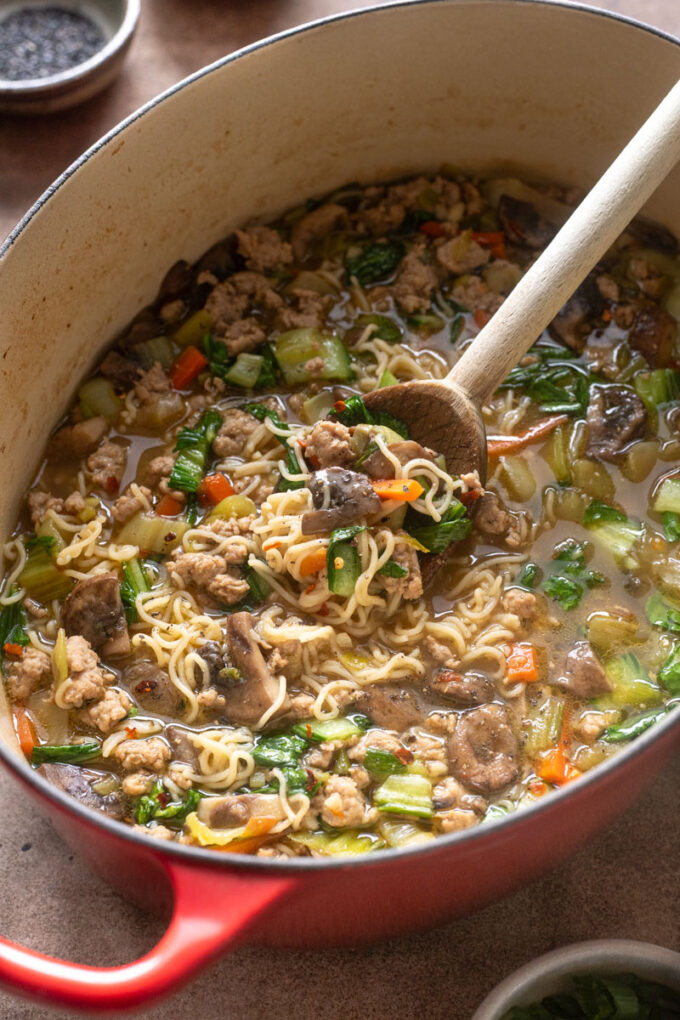 Ground pork ramen with bok choy in Dutch oven.