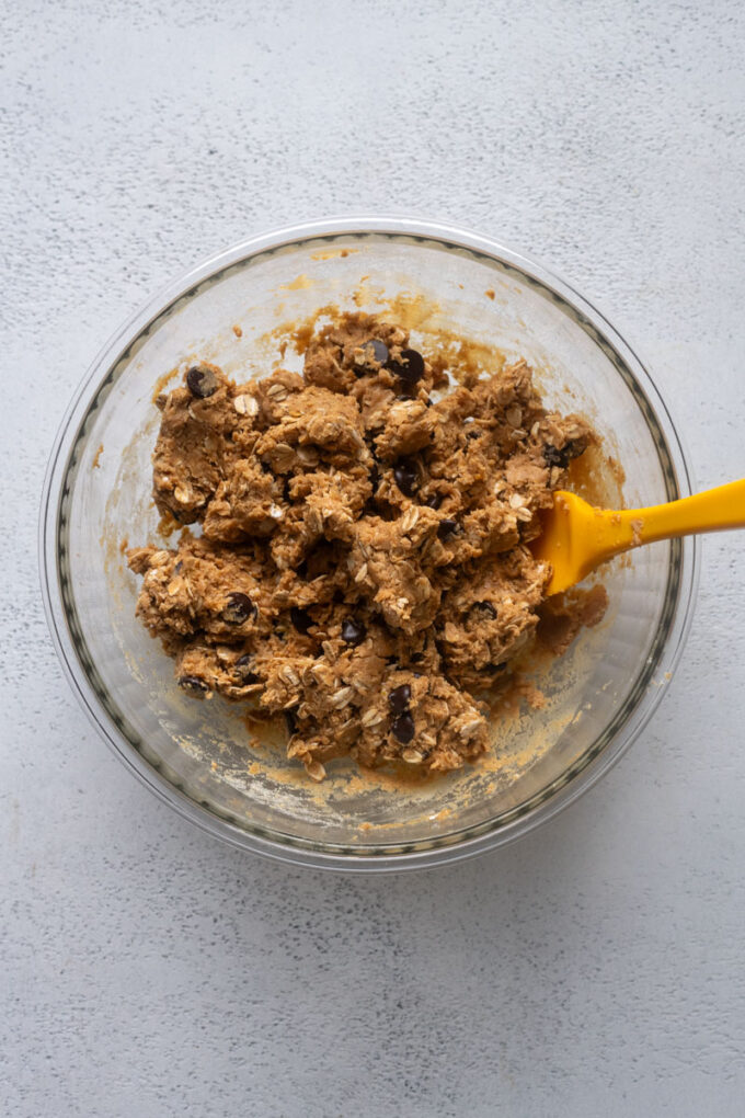 Peanut butter protein ball dough combined in a bowl.