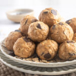 Peanut Butter Protein Balls piled on a plate.