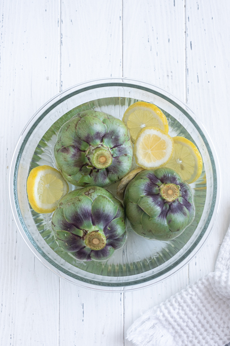Prepped artichokes in lemon water for instant pot artichokes.