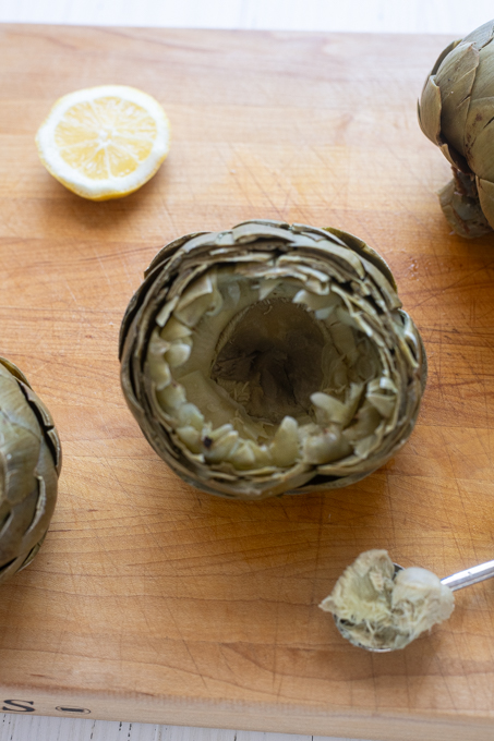 Steamed artichoke with fuzzy choke removed.