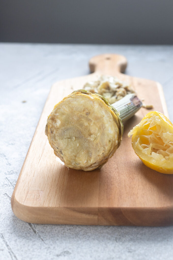 Fully prepped artichoke with the tough outer leaves removed and choke scooped out.