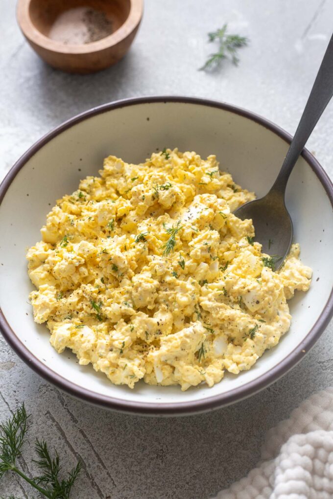 Egg salad with dill in a bowl.