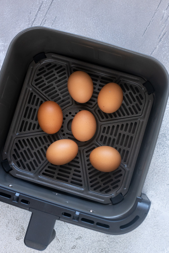 Hard boiled eggs in the air fryer basket.