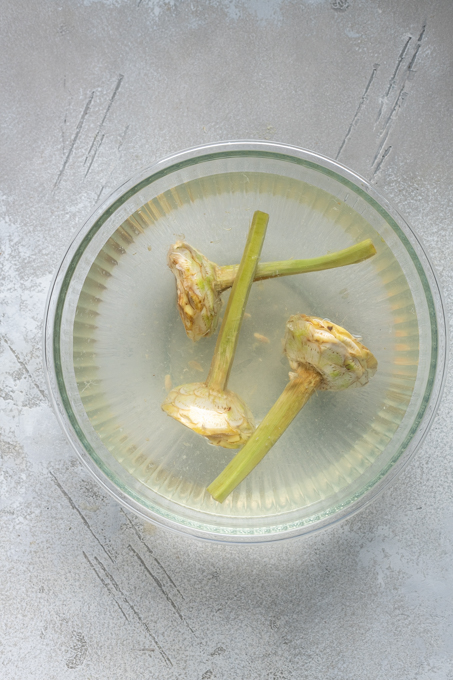 Prepped Roman artichokes in lemon water.