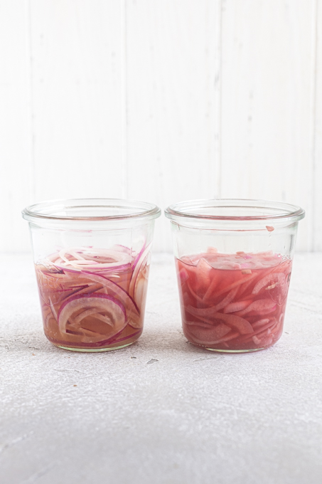 Before and after shot of pickled red onions in jars side by side.