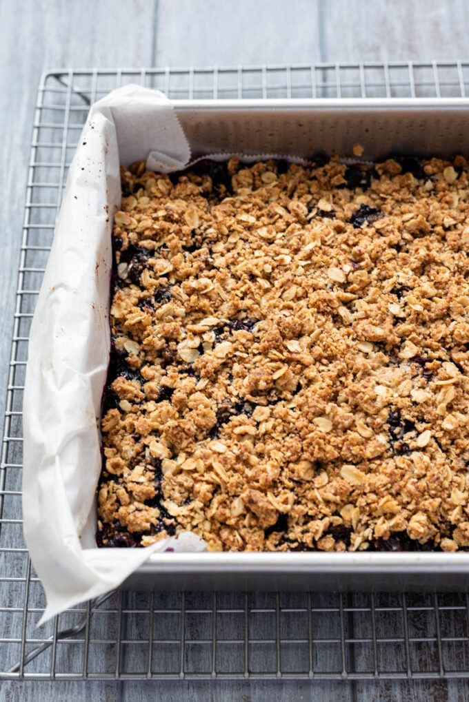 Blueberry crumble bars in baking pan.