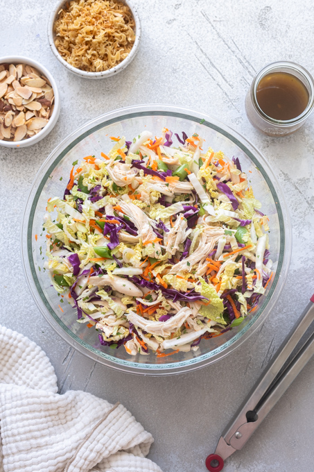 Chinese chicken salad combined in mixing bowl.