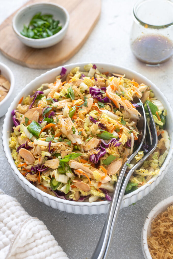 Chinese chicken salad with ramen noodles in a bowl.