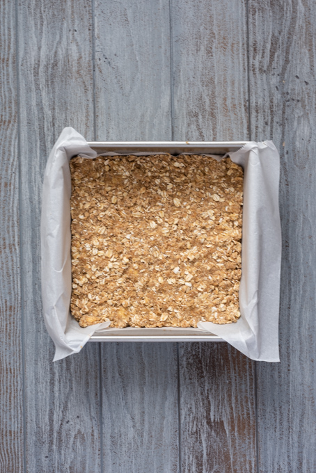 Par baked oat crumble crust in pan.