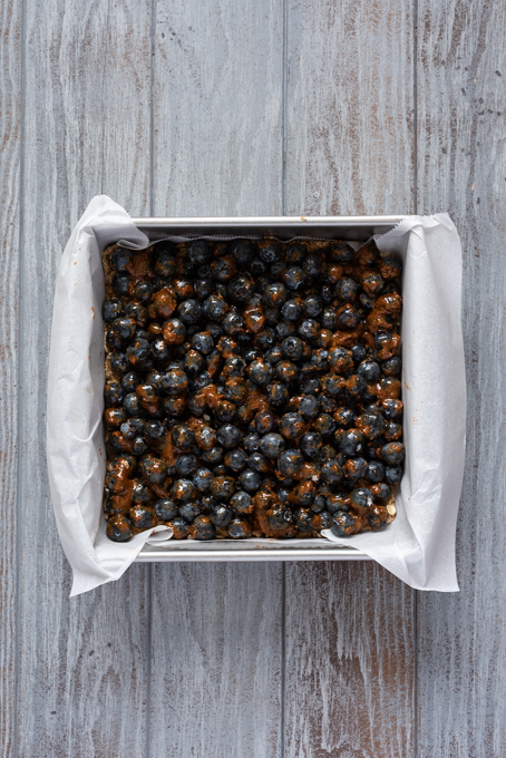 Blueberry filling on top of par baked oatmeal crumble.
