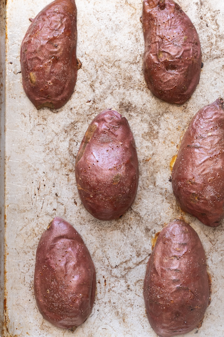 Oven roasted sweet potato halves skin side up after baking.