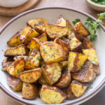 Ranch potatoes in a bowl garnished with parsley.