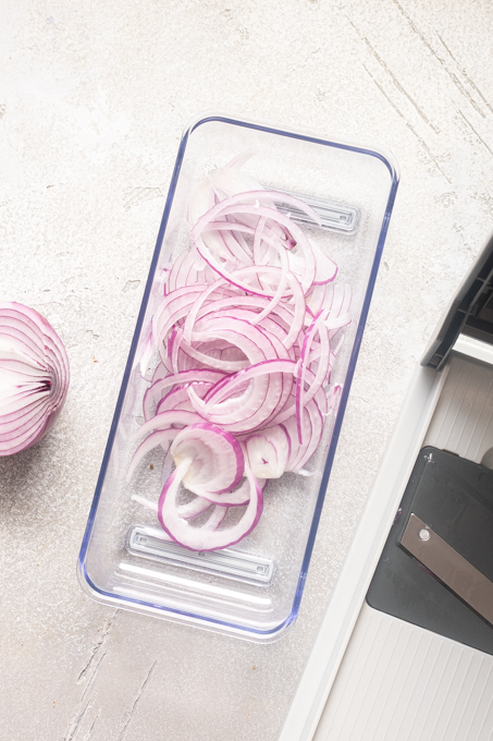 Red onion sliced with a mandoline.