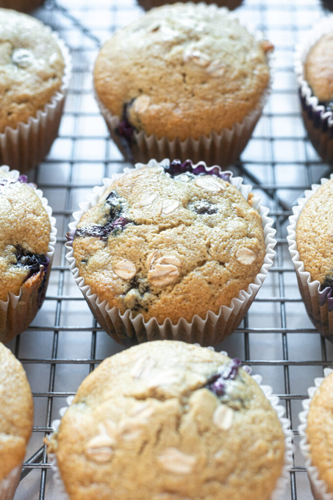 Gluten-free blueberry oatmeal muffins on a wire rack.