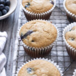 Blueberry Oat Flour Muffins on a wire rack.