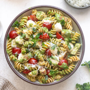 Chicken Pesto Pasta Salad with fresh basil and parmesan cheese.