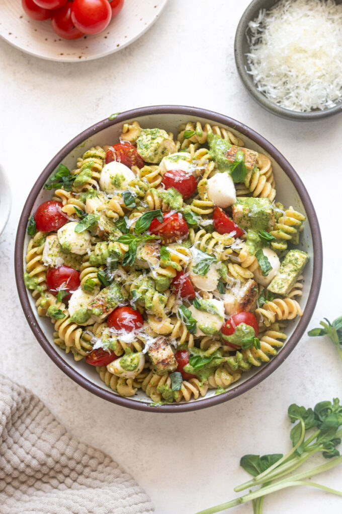 Chicken Pesto Pasta Salad with fresh basil and parmesan cheese.