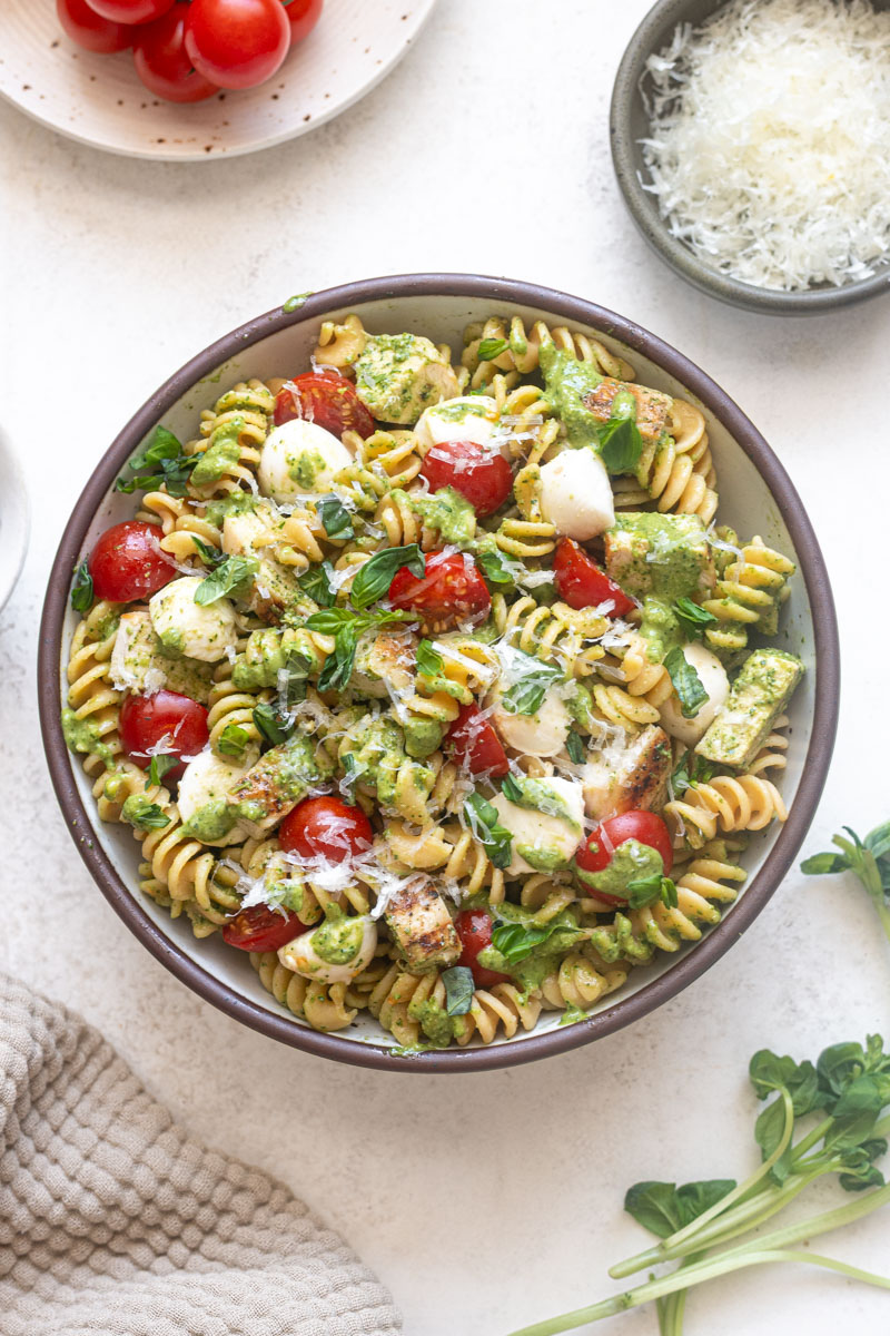 Chicken Pesto Pasta Salad with fresh basil and parmesan cheese.