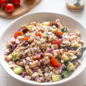 Tuna white bean salad in a white serving bowl.