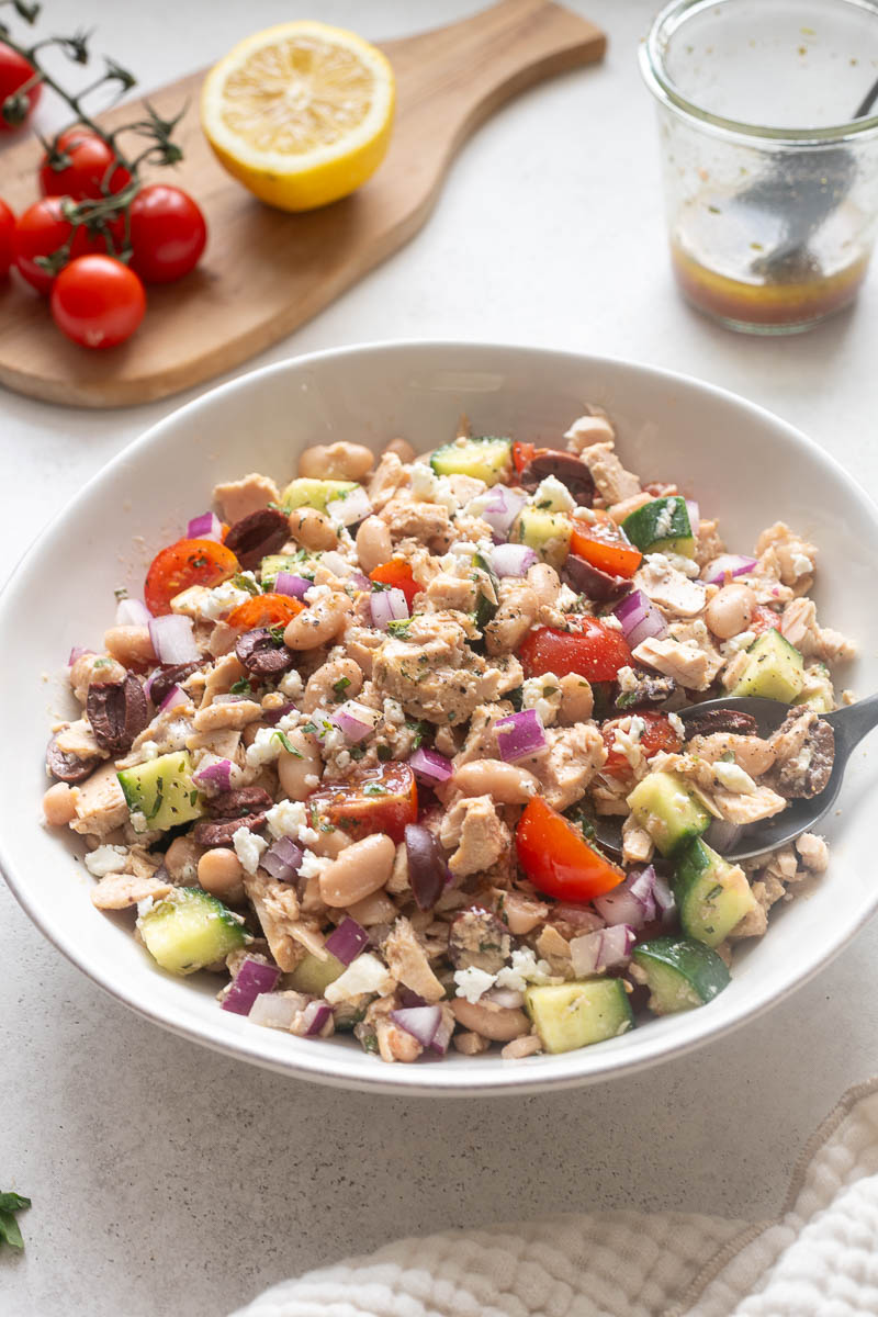 Tuna white bean salad in a white serving bowl.