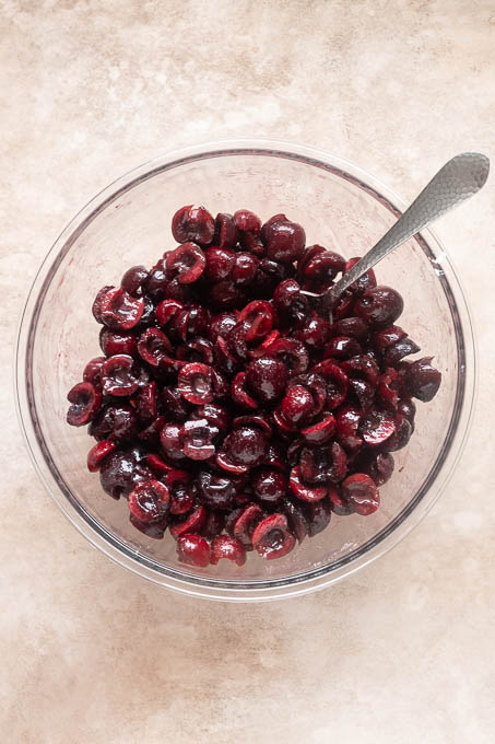 Cherry crisp filling in mixing bowl.