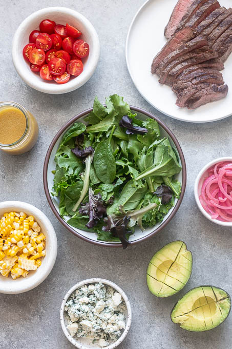 Prepped ingredients for grilled steak salad.