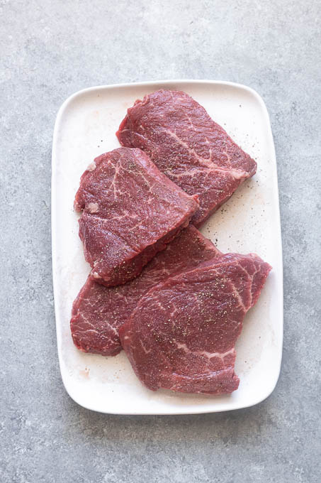 Seasoned steaks for grilled steak salad.