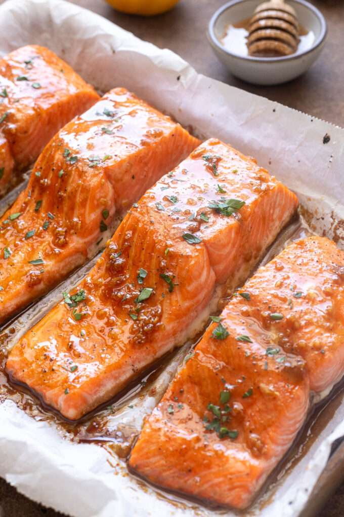 Honey garlic glazed salmon on baking sheet.