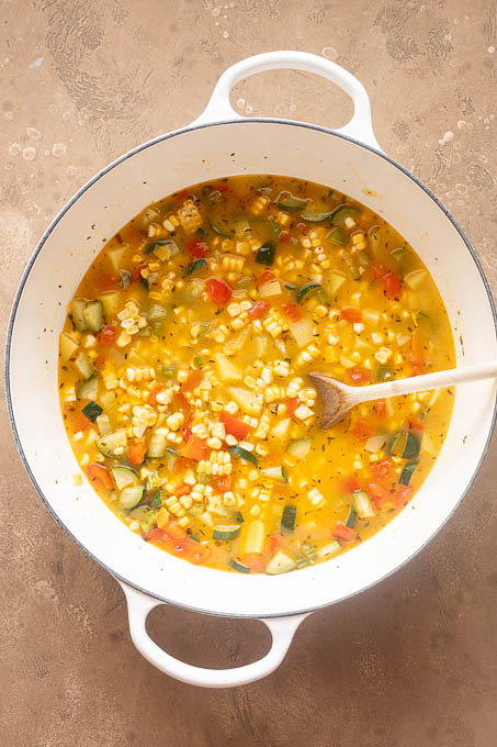 Corn chowder with corn and zucchini.