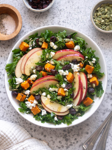 Fall harvest salad with kale, roasted butternut squash, apples, feta, cranberries and pepitas.