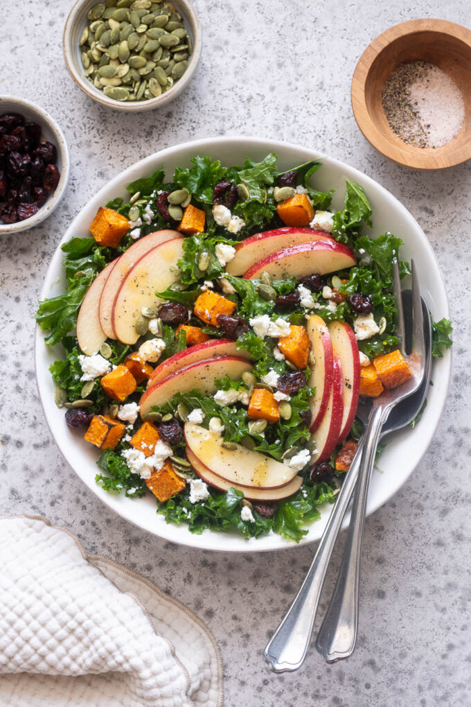 Fall kale salad with roasted butternut squash, sliced apples, cranberries, feta and pepitas.