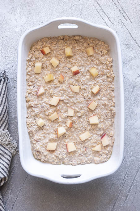 Overnight apple baked oatmeal in baking dish before baking.