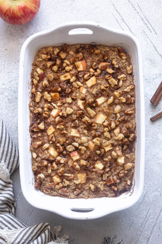 Overnight apple cinnamon baked oatmeal in baking dish.