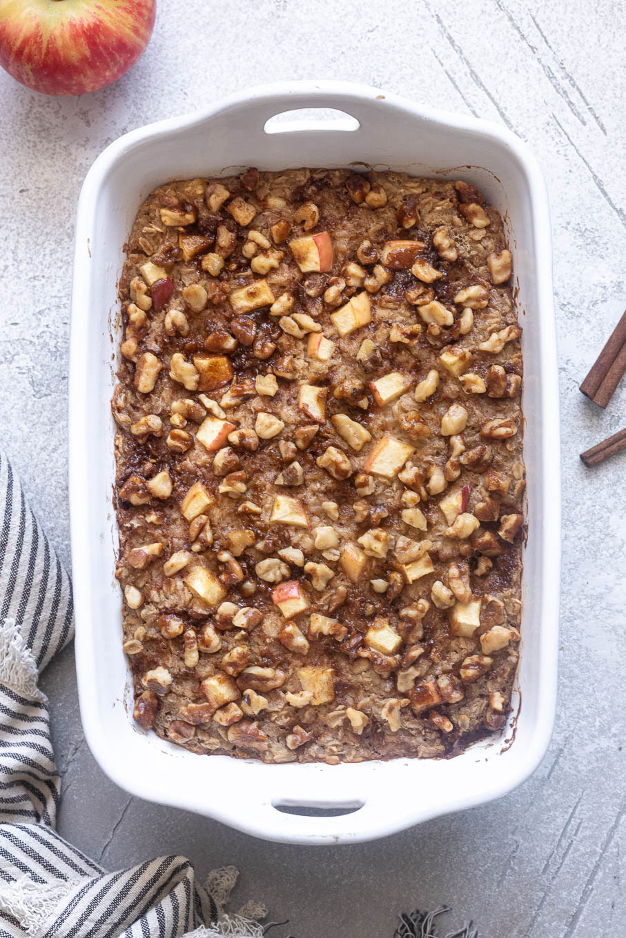 Overnight apple cinnamon baked oatmeal in baking dish.