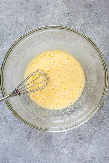 Wet ingredients for French apple cake recipe.