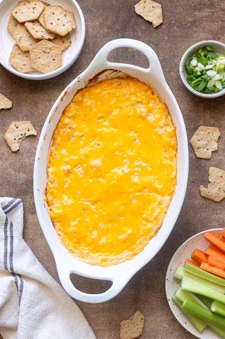 High protein buffalo chicken dip in a baking dish after baking.