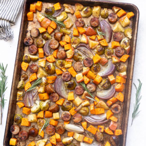 Sheet pan sausage and fall vegetables with maple Dijon sauce.