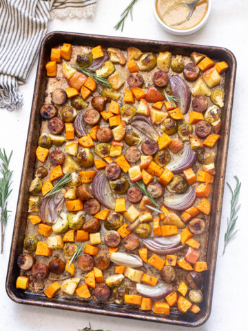 Sheet pan sausage and fall vegetables with maple Dijon sauce.