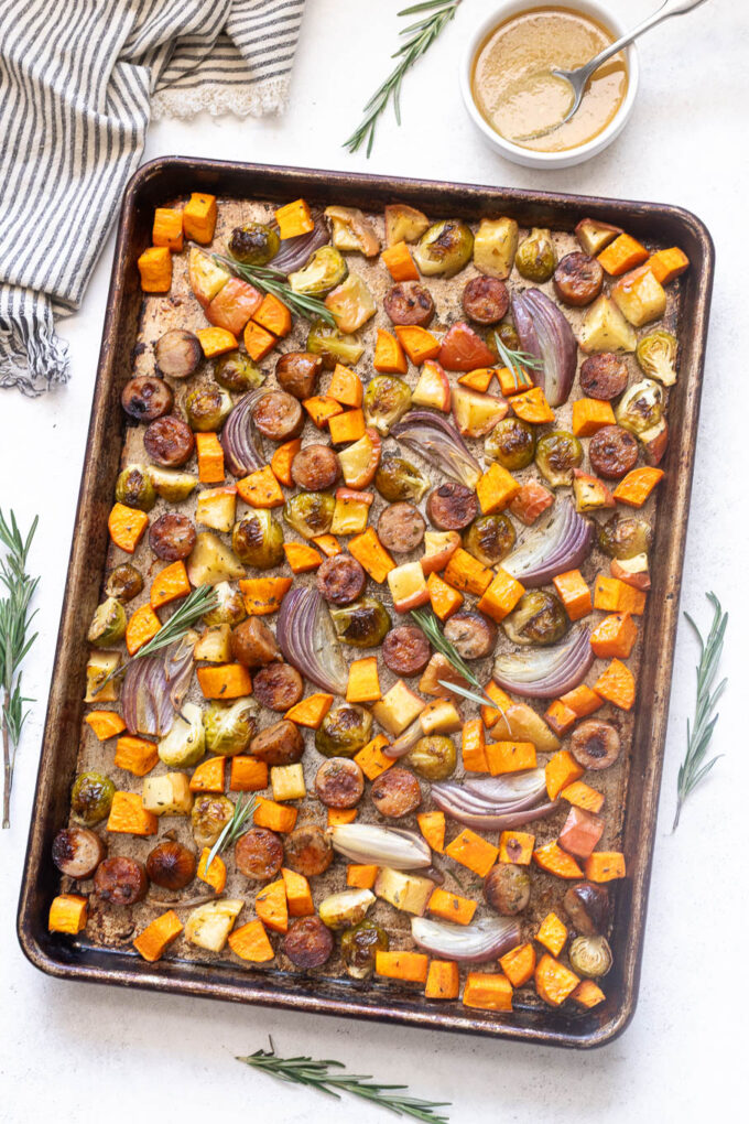 Sheet pan sausage and fall vegetables with maple Dijon sauce.